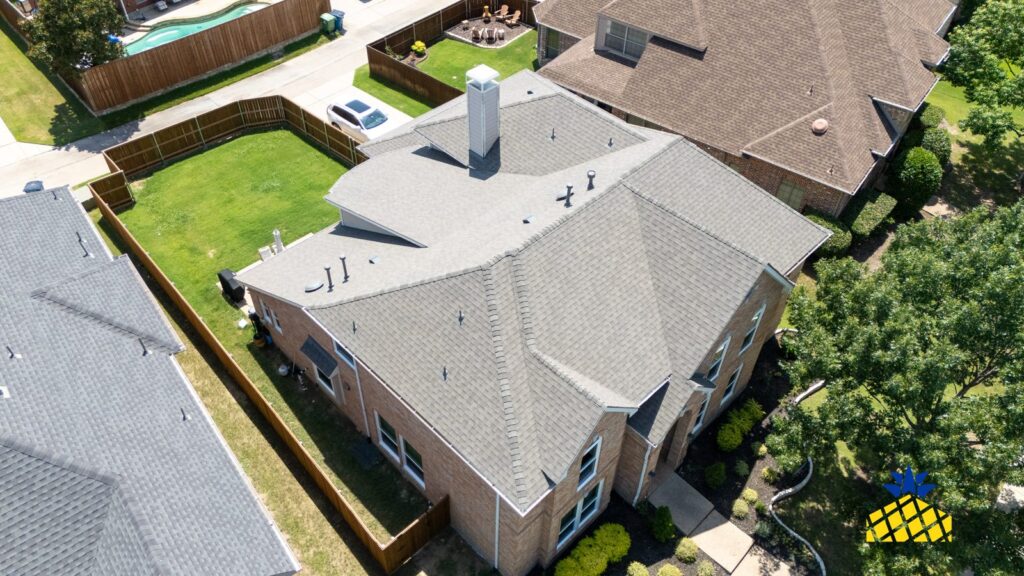 Aerial view of a Lewisville, TX home showing the roof edges and gutter lines